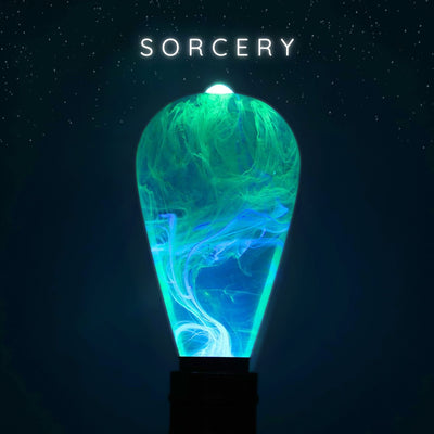 A glowing green light bulb with a swirl pattern, labeled 'SORCERY' on a dark background.